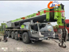 A used 2021 Zoomlion 220-ton, 8-section boom ZAT2200H8 truck crane in excellent condition, suitable for all heavy construction machinery applications.