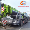 A used 2021 Zoomlion 220-ton, 8-section boom ZAT2200H8 truck crane in excellent condition, suitable for all heavy construction machinery applications.